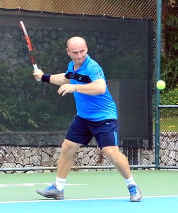 Daniel Rajsky exhibits his tennis prowess during the singles competition.