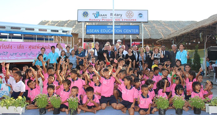 The children join the sponsors, Rotarians and teachers for a group photo.