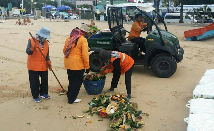 A cleaning crew of about 15 people fanned out across Pattaya and Jomtien beaches Nov. 15, picking up the remnants of the celebration the night before.