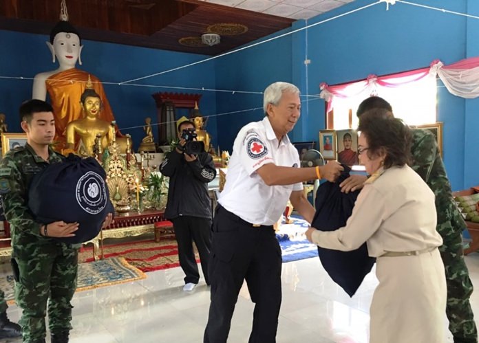 Apai Janthanajulaka, Vice President of the Princess of Pa Foundation, Red Cross Society was designated by HRH Princess Soamsawali to distribute royal aid to Mae Taeng villagers hit by flash floods.