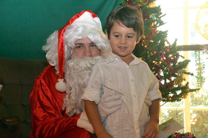 Santa stopped by to great the children and listen to what they want for Christmas.