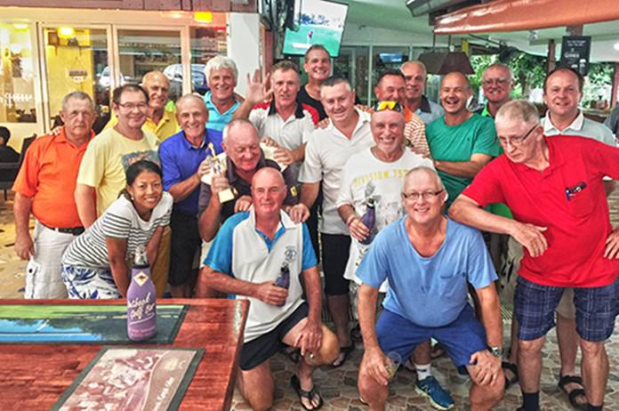 Bob Newell (left, 2nd row) holds the trophy as the Outback team pose for a photo following their matchplay victory over the German Swiss Golf Society.
