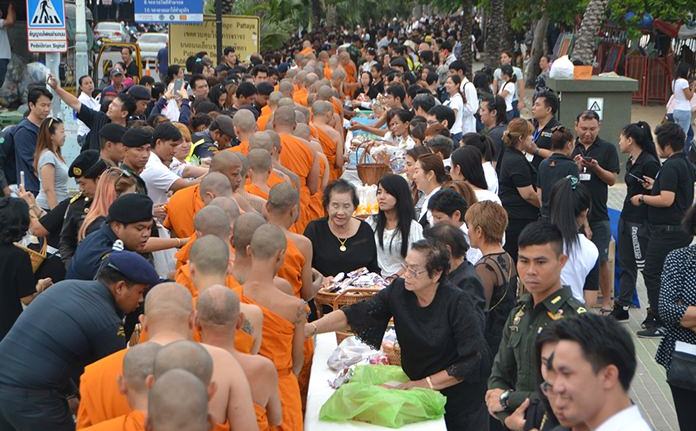 Residents gather to give alms to 89 monks on the occasion of Father’s Day.