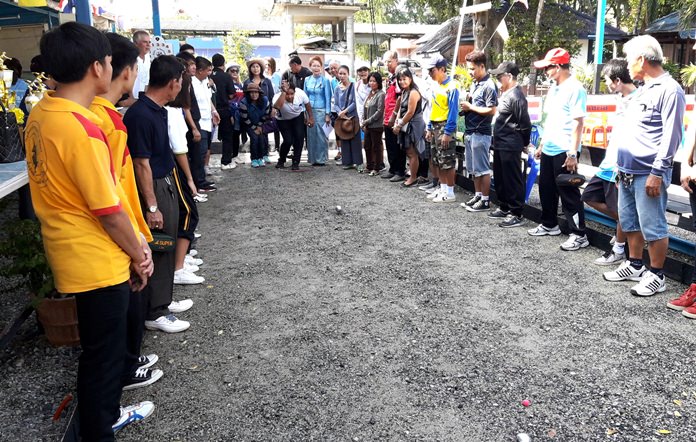 Nakorn Pollukin, former member of Pattaya Council, pitches a petanque ball to officially open the event.