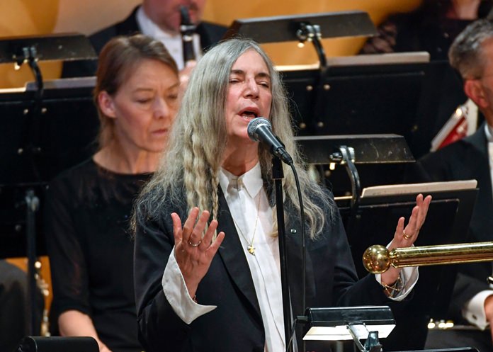 In this Saturday, Dec. 10, 2016 file photo, US singer Patti Smith performs “A Hard Rain’s A-Gonna Fall” by absent 2016 Nobel literature laureate Bob Dylan during the 2016 Nobel prize award ceremony at the Stockholm Concert Hall in Sweden. (AP Photo)