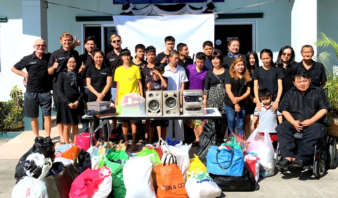 Local ITL members make a donation at the Father Ray Foundation children’s home in Pattaya.