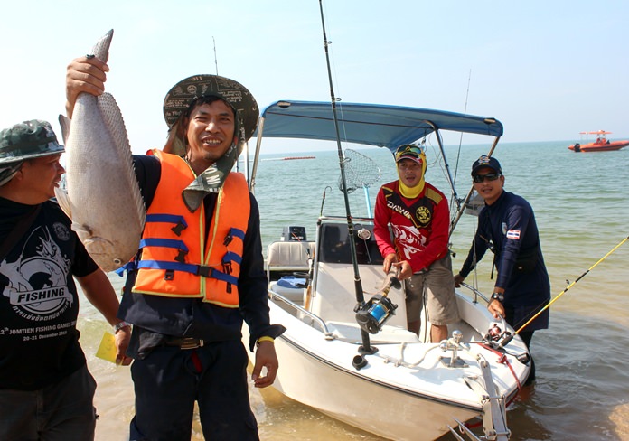 Happy anglers return to shore with their prize catch.