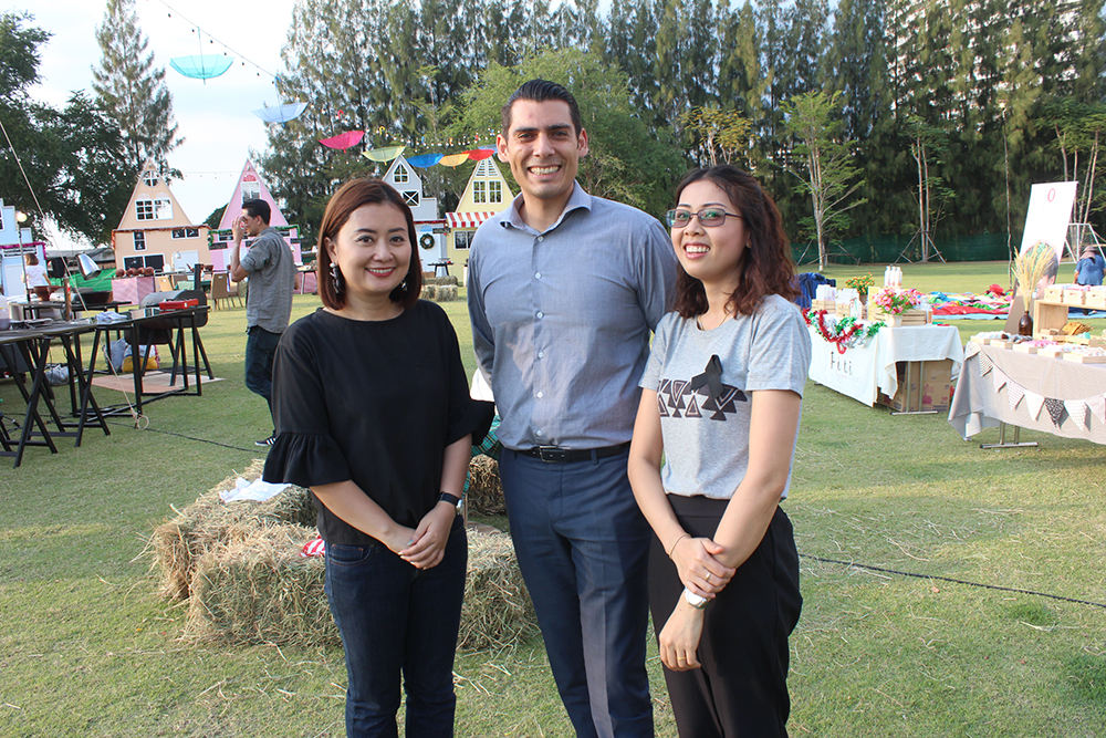 (L to R) Chittima Dachanaphirom, marketing communications manager, and Adel Mojarrad, FB director welcome Nutsara Duangsri from the Pattaya Mail and all comers to the Swiss-mas Market Fair at Mövenpick Siam Hotel.