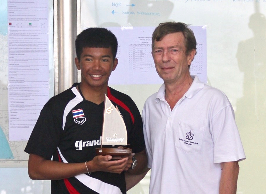 Laser Radial winner Apiwat Sringam (left) receives his trophy from RVYC Rear Commodore Chris Dando.
