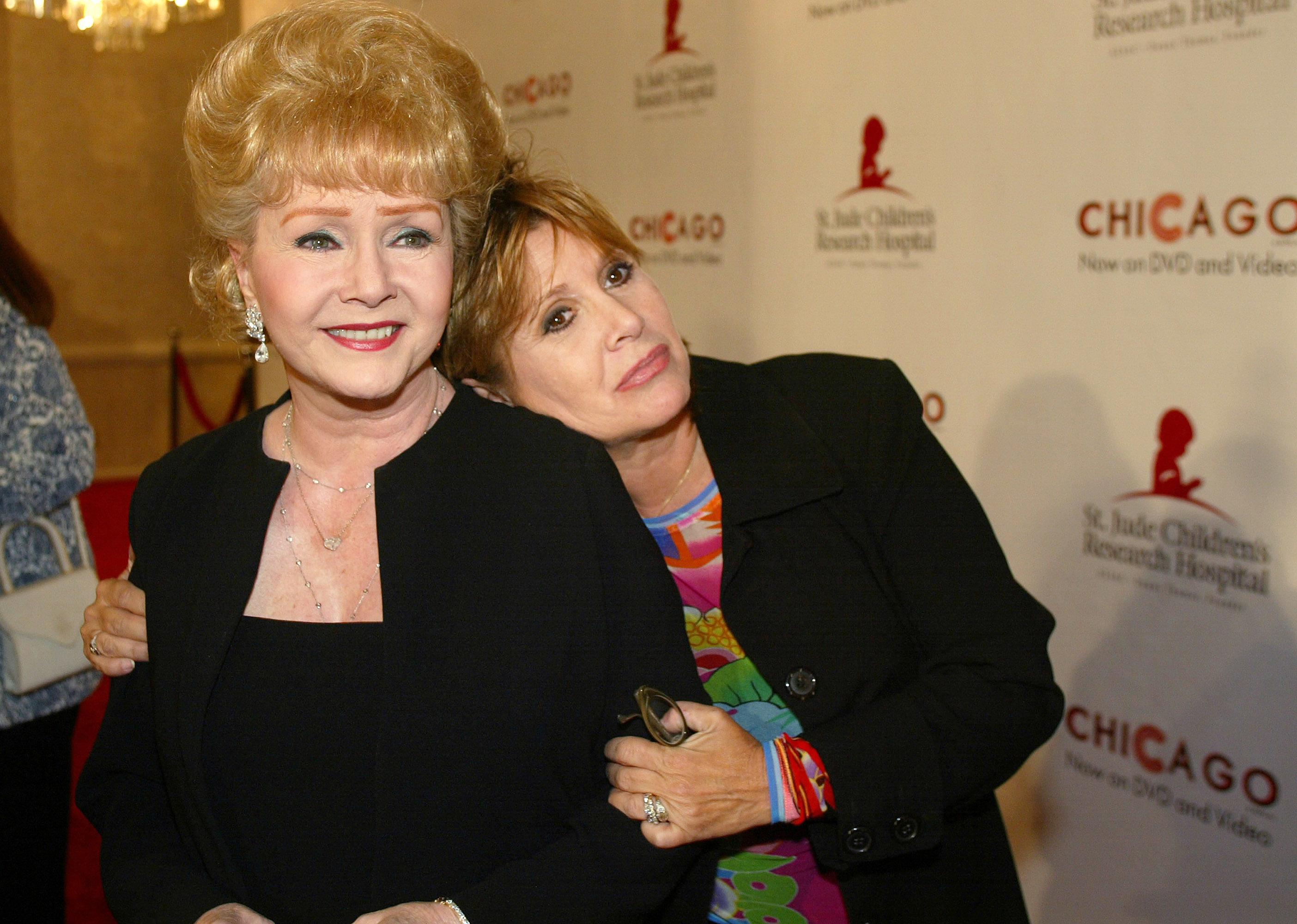 Debbie Reynolds, left, and daughter Carrie Fisher are shown together in this Aug. 19, 2003 file photo. (AP Photo/Jill Connelly)