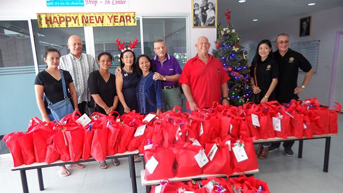 The Rotarians brought 80 Christmas bags with them.