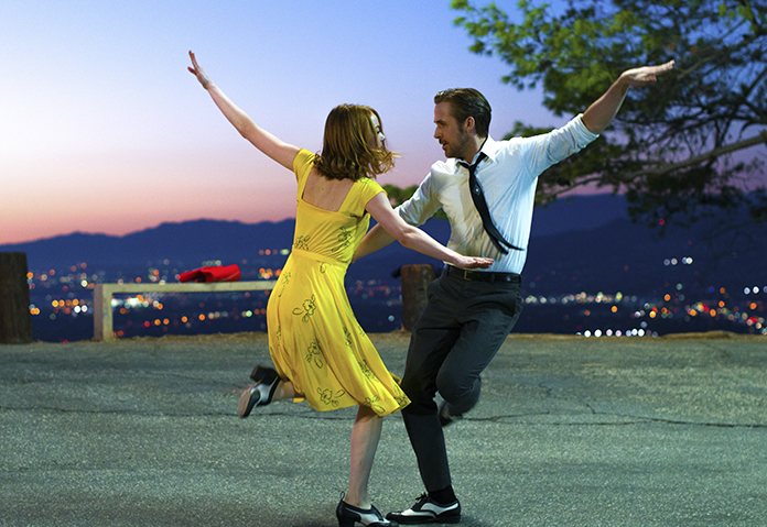 This image released by Lionsgate shows Ryan Gosling (right) and Emma Stone in a scene from, "La La Land." (Dale Robinette/Lionsgate via AP)