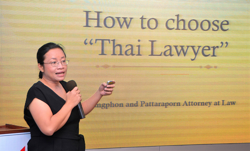 Lawyer Pattaraporn (Oy) Chantaramaha introduces her topic, How to Choose a Thai Lawyer, to her PCEC audience.