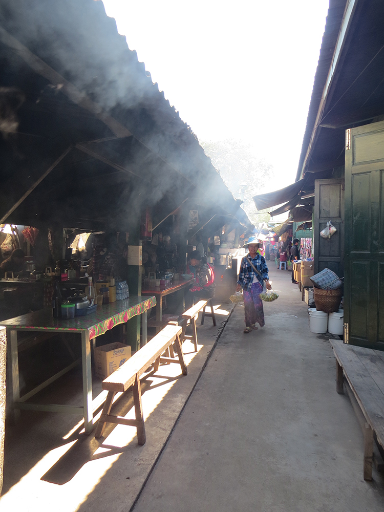 Cooking is all wood fire in the Kengtung Market and the narrow alleys are filled with smoke as people fill up on Shan noodles, baked flatbread and more.