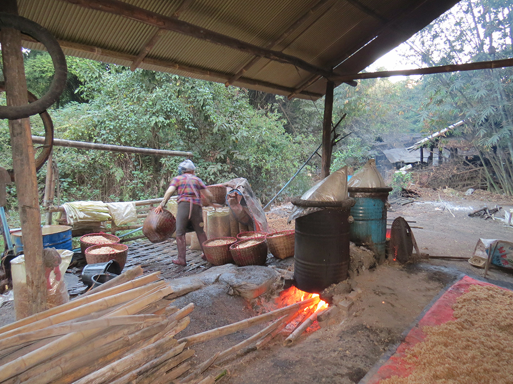 Villagers brew rice whiskey the old fashioned way.