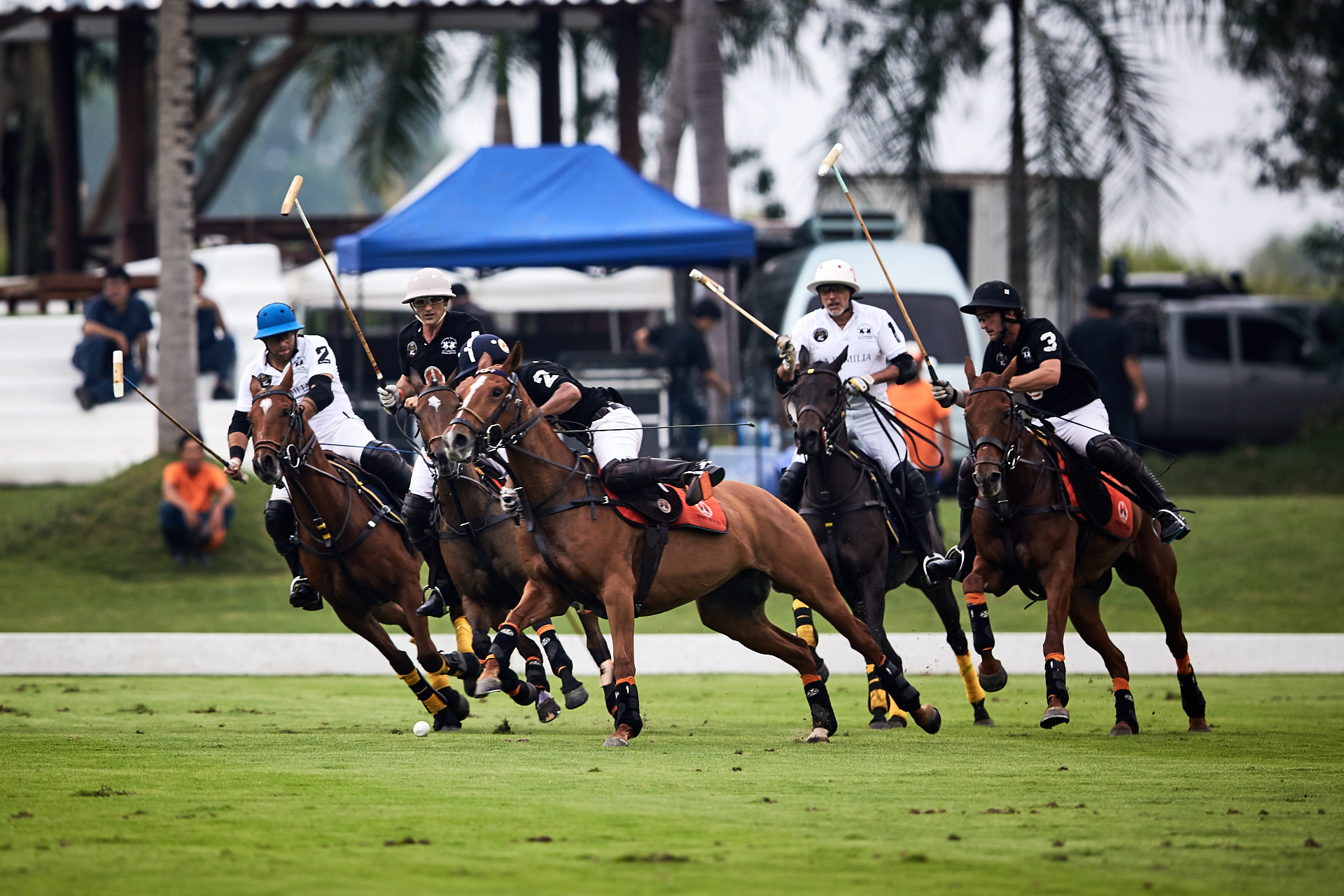 Thai Polo and La Familia players battle for possession during the first chukka of the final.