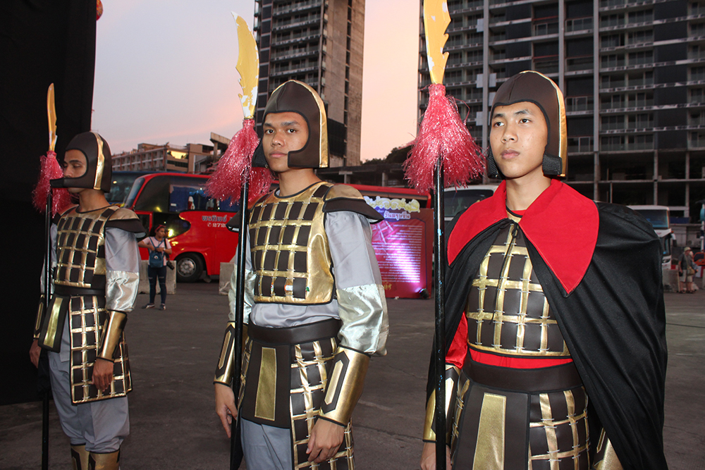 Chinese war soldiers guard the area in their ancient reenactment outfits.