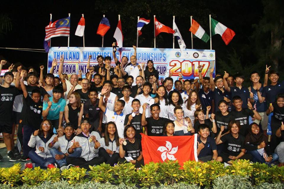 Windsurfers and competition officials pose for a group photo during the medal presentation for the Thailand Windsurfing Championships & Pattaya International Windsurfing Cup 2017, held at the Watersports Center on Jomtien Beach, Pattaya, January 23.