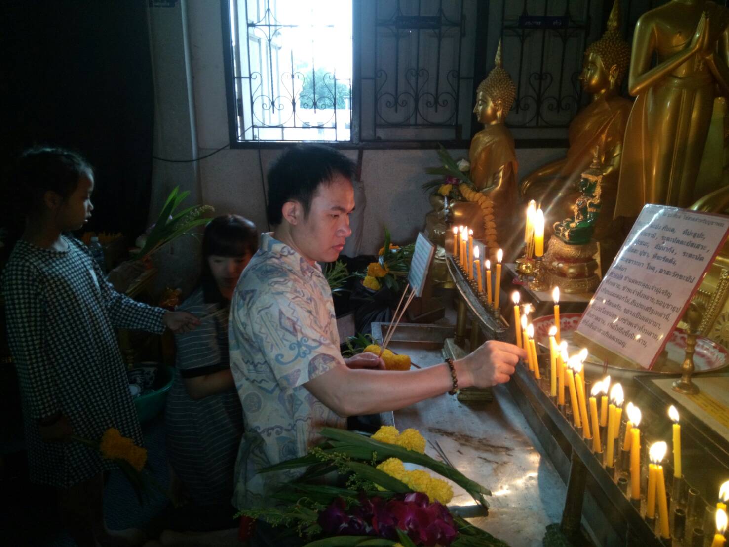 People light candles for prosperity at Wat Prachomkhongkha in Rongpoh.