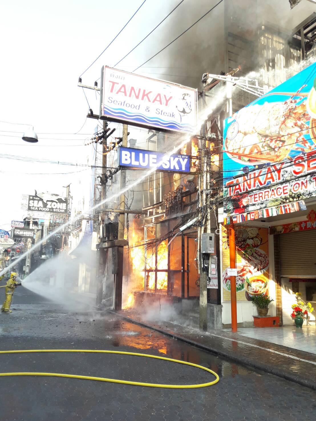 Fire fighters tackle the flames at the Blue Sky pub on Walking Street