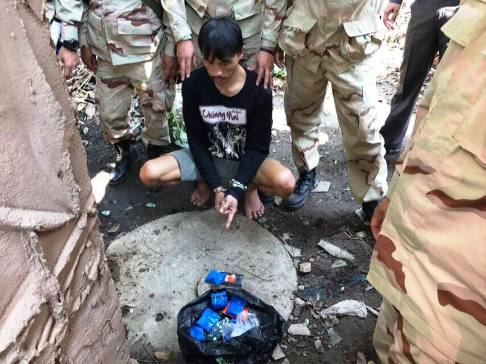 Police arrested a suspected drug dealer after he barricaded himself in his house before finally surrendering himself.