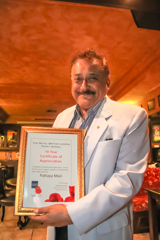 Peter Malhotra proudly displays the Certificate of Appreciation presented to Pattaya Mail for the more than 10 years of fulsome, and most generous support, to all the activities of the Royal British Legion in Thailand.