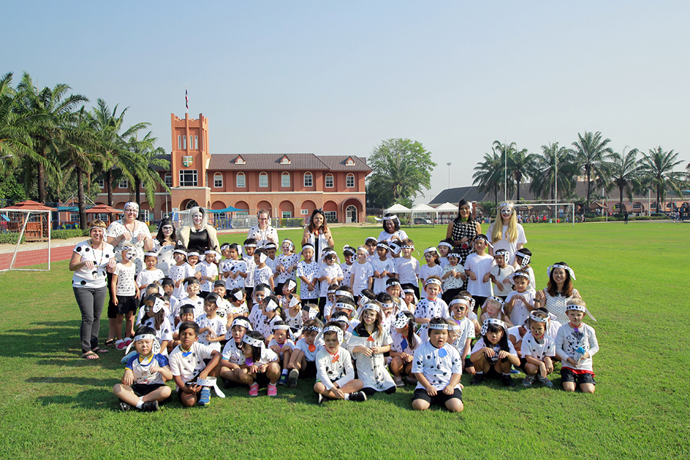 Year 1 pupils dressed as 101 Dalmatians with Head of Early Years, Jo Smith as Cruella Deville (back row, 4th from left).