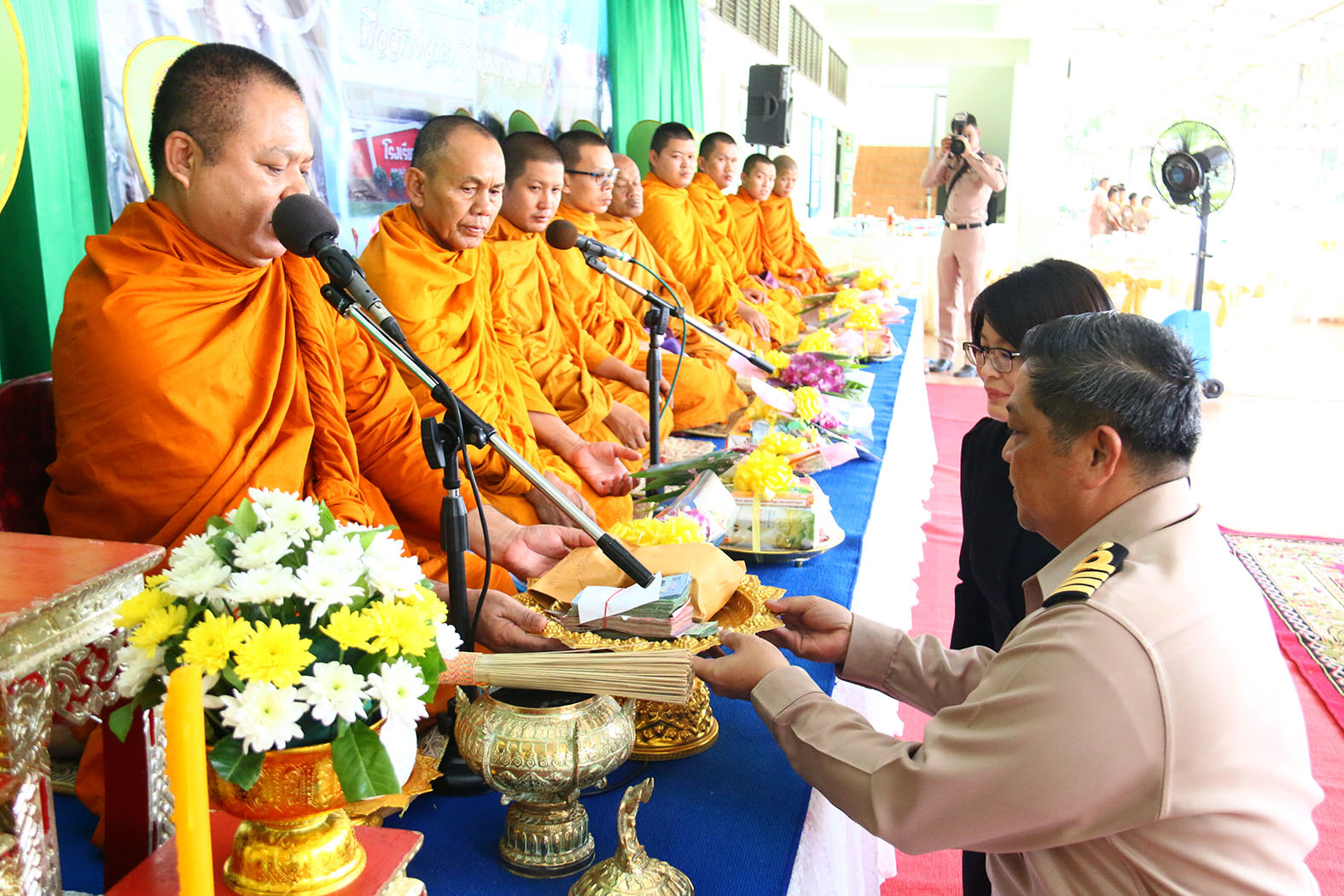 ACDC 1st Regiment commander Capt. Panom Kuanpradith presents 715,908 baht to Phra Wisarntasutakorn