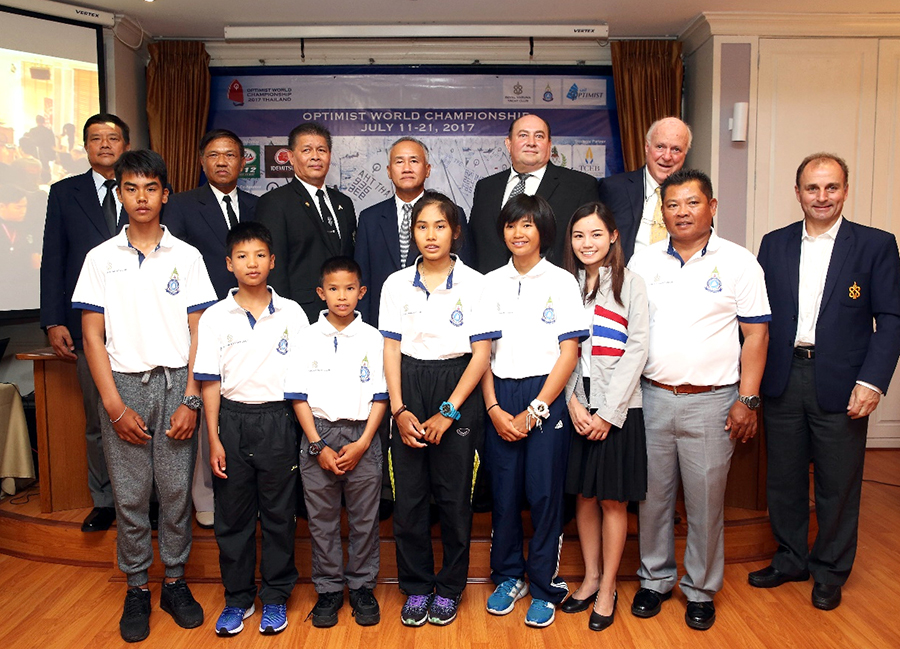 Adm. Kraisorn Chansuvanich (4th left, rear) and Thomas Whitcraft (2nd right, rear) stand with event organizers and competing sailors at a press conference to officially announce the Optimist World Championship 2017, to be held in Pattaya from July 11-21.