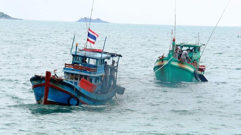 Two of the three Vietnamese fishing boats illegally fishing in Thai waters are brought in for their crews to face charges.