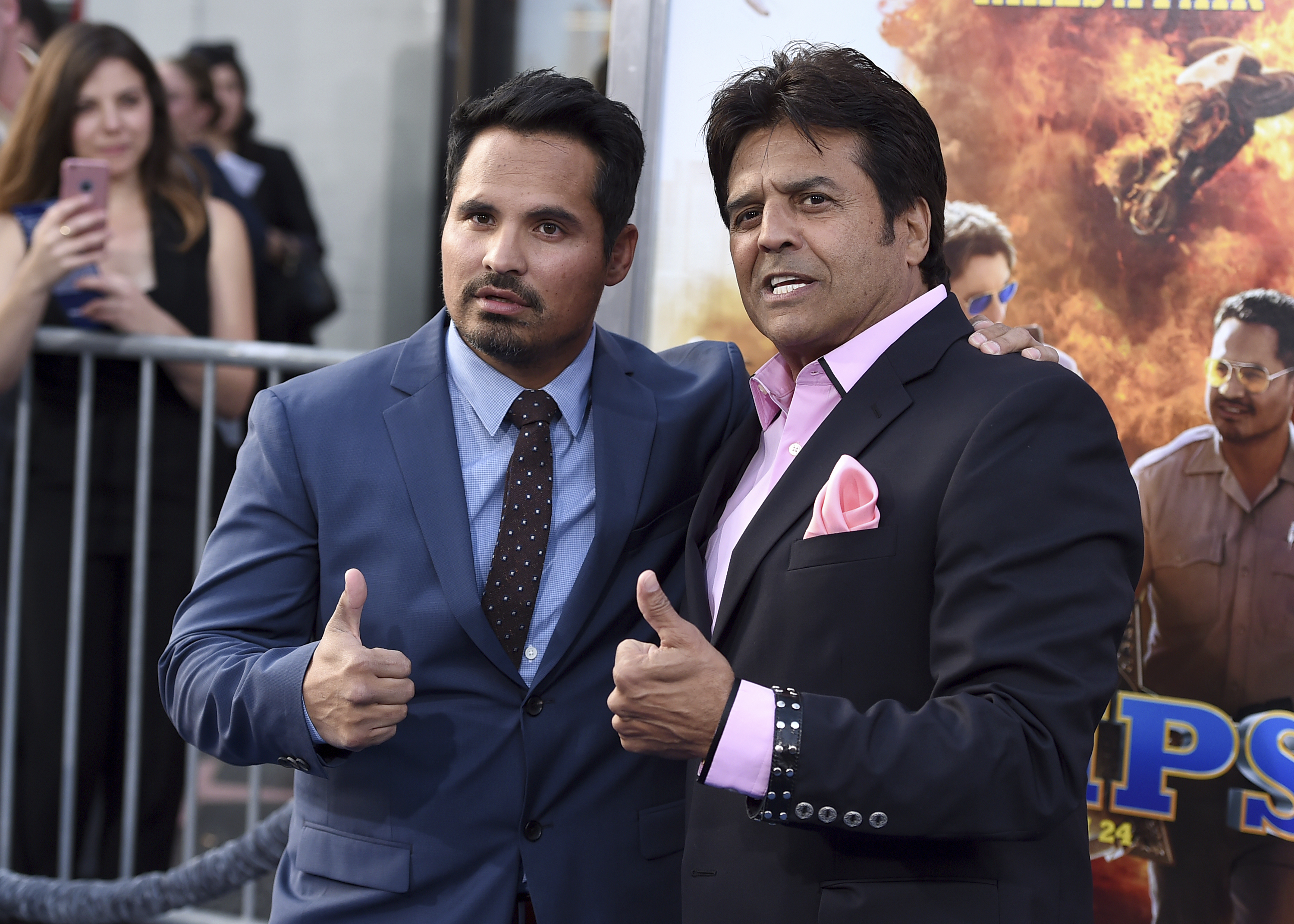 Michael Pena (left) and Erik Estrada pose at the Los Angeles premiere of "CHIPS" at the TCL Chinese Theatre on Monday, March 20. (Photo by Jordan Strauss/Invision/AP)