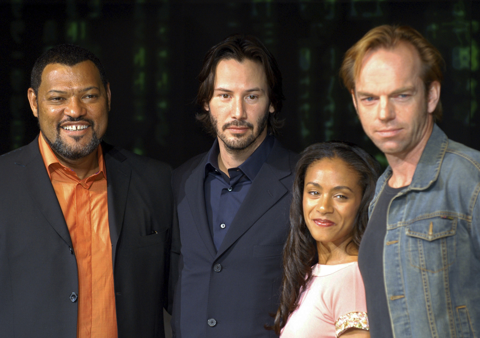 From left: Matrix cast members Laurence Fishburne, Keanu Reeves, Jada Pinkett Smith and Hugo Weaving are shown in this May 27, 2003 file photo. (AP Photo/Koji Sasahara)