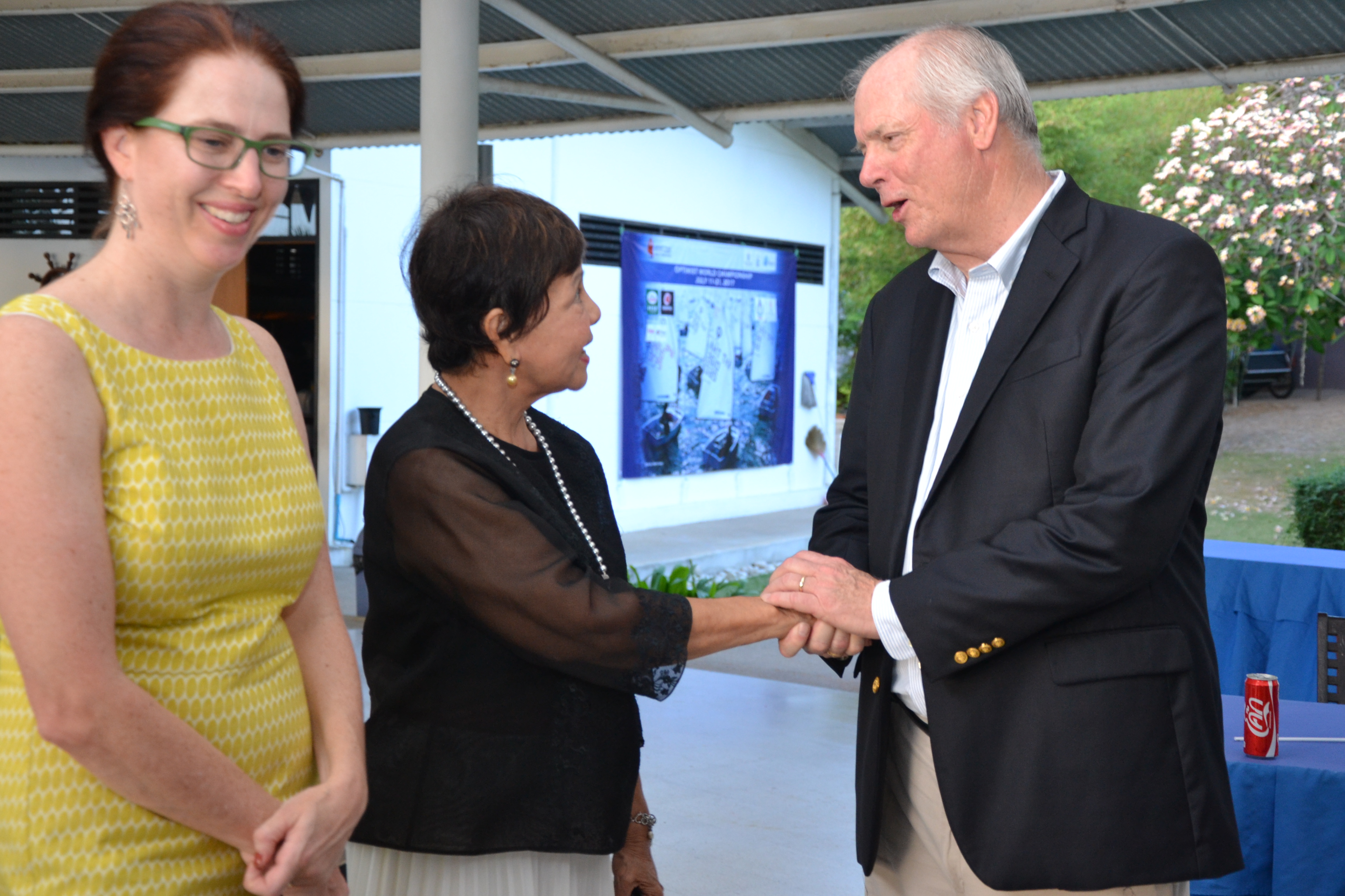 Anne Lee Seshadri, Cultural & Educational Officer of the US Embassy Bangkok seems delighted as Gary Jobson greets Sopin Thappajug. 