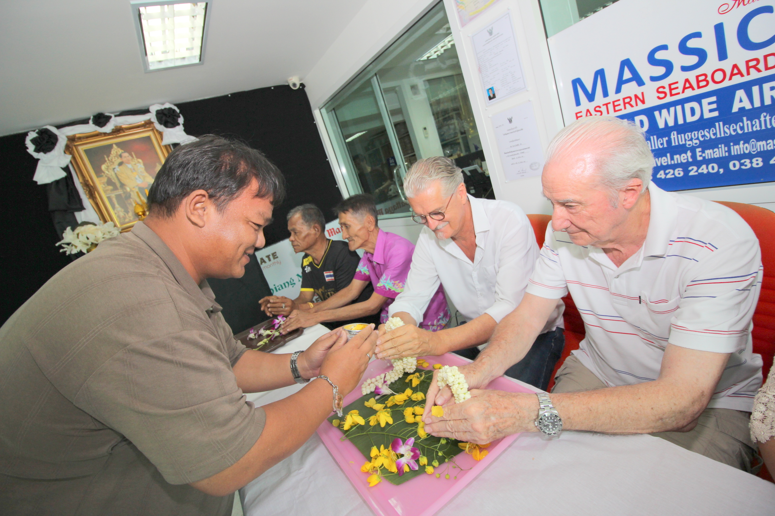 Thanawat Suansuk receives blessings from Jo Klemm and Dr. Iain Corness.