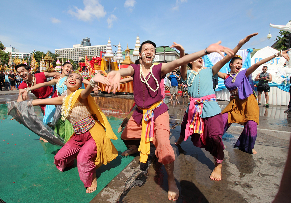 Performers in the Thai arts show on Pattaya Beach Road show tremendous poise getting soaked while displaying Thai culture.