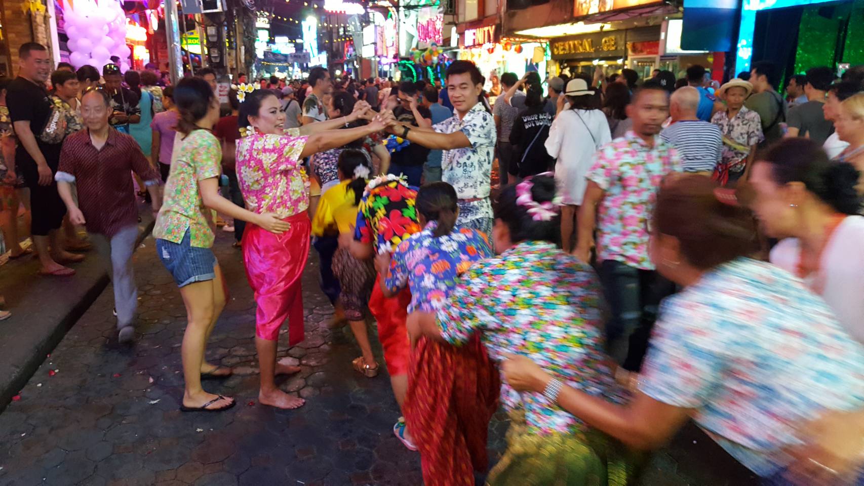 The Pattaya Women’s Development Club showed off traditional Thai fashion and games during the Songkran Festival on Walking Street. Shown here, they play Rere Khaosan, a Thai version of London Bridges.