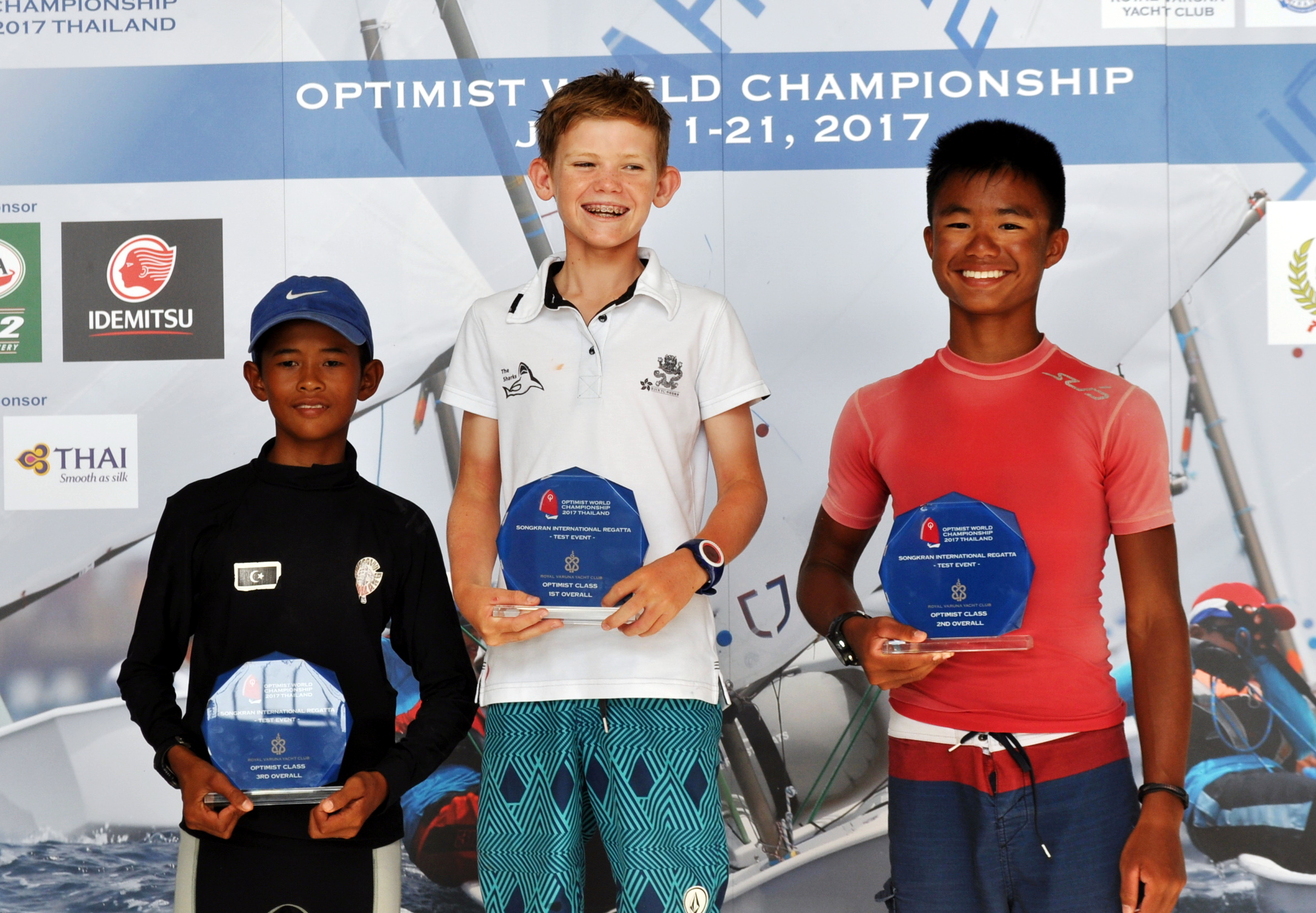 Individual winner Duncan Gregor of Hong Kong (centre) poses on the podium with Muhammed Khaidir Bin Mohd Zahawi from Malaysia (left) and Muhammad Daniel Kei, representing Singapore (right).