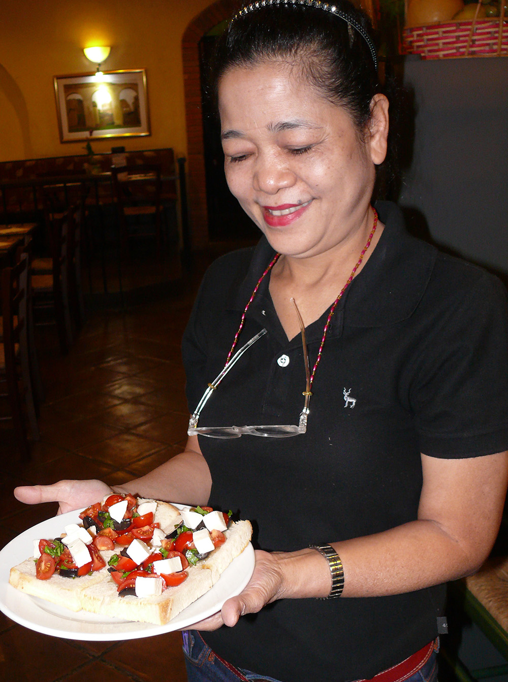 Bruschetta being brought to the table.