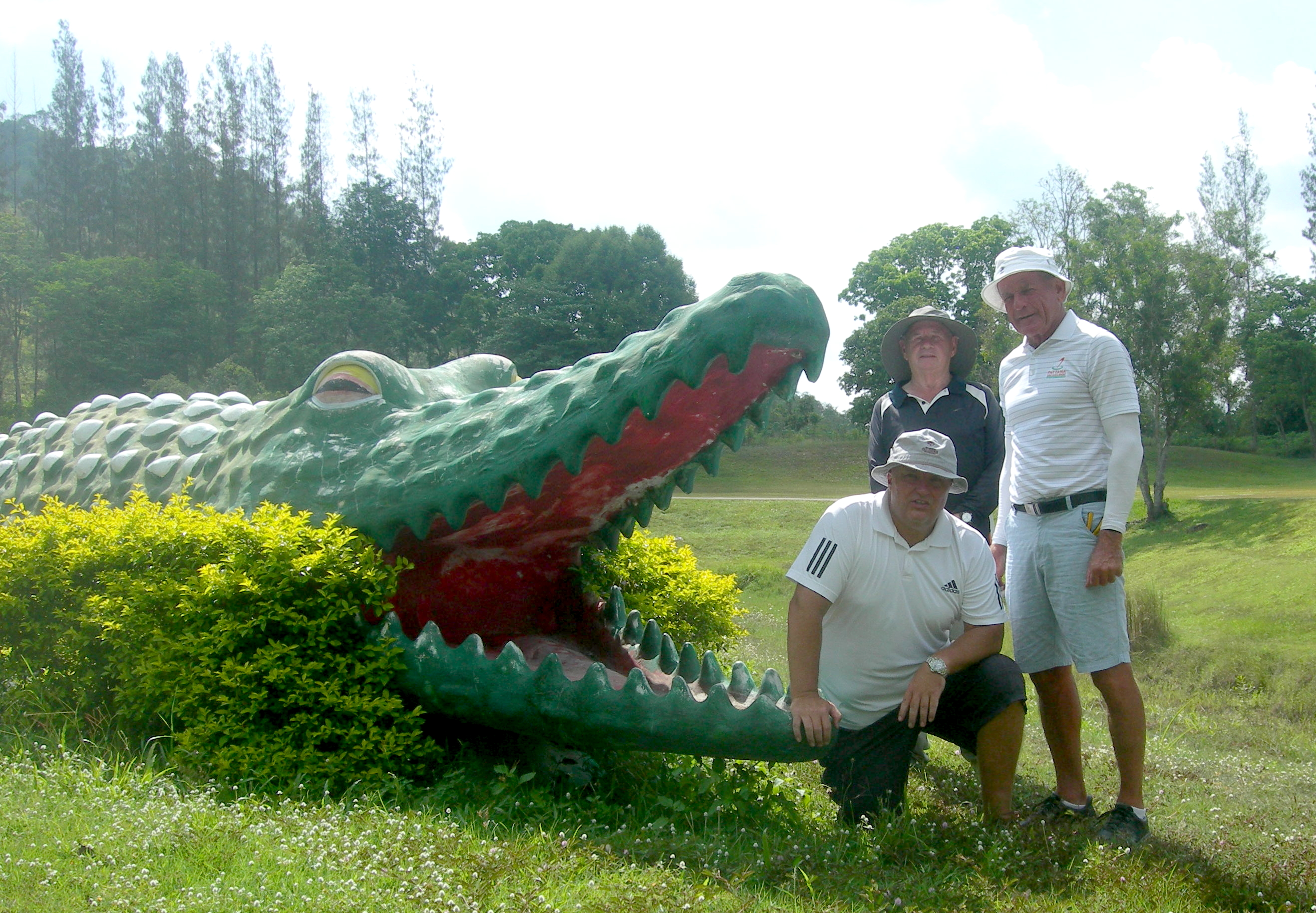 Dave Smith, Willie Hogg and Paddy Devereux feed the Treasure Hill croc.
