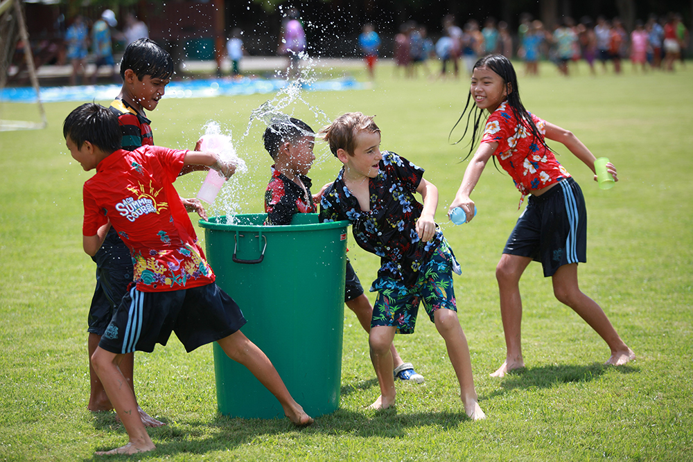 Students soaked each other during the Songkran celebrations.