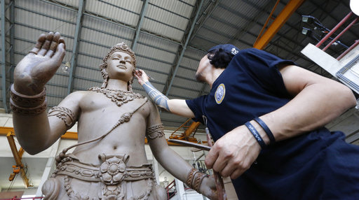 An artist sculpts deities and creatures from ancient Indian epics to decorate the royal crematorium for the late Thai King Bhumibol Adulyadej at the Office of Traditional Arts in Nakhon Pathom province, Thailand, Thursday, April 20, 2017.(AP Photo/Sakchai Lalit)