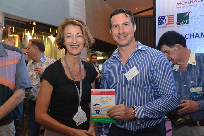 Joanna Kearney from Regents International School presents Andy Hall from CEA Project Logistics with a lucky draw prize.