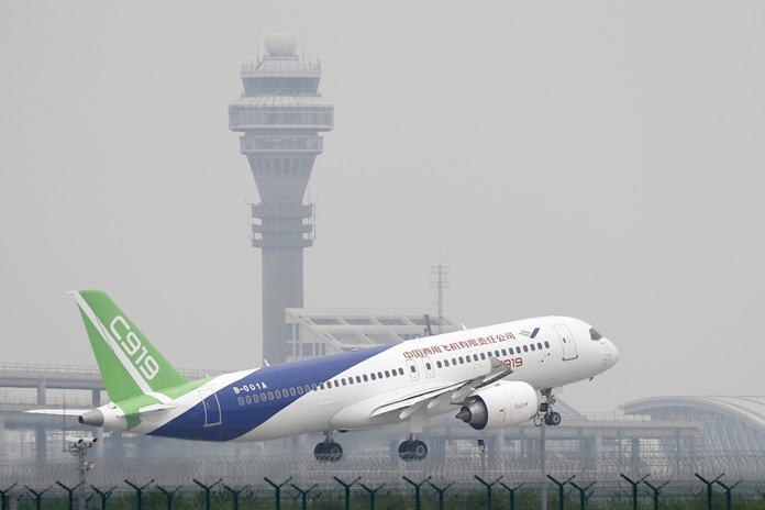 A Chinese-made C919 passenger jet takes off on its first flight at Pudong International Airport in Shanghai, Friday, May 5, 2017. (AP Photo/Andy Wong, Pool)