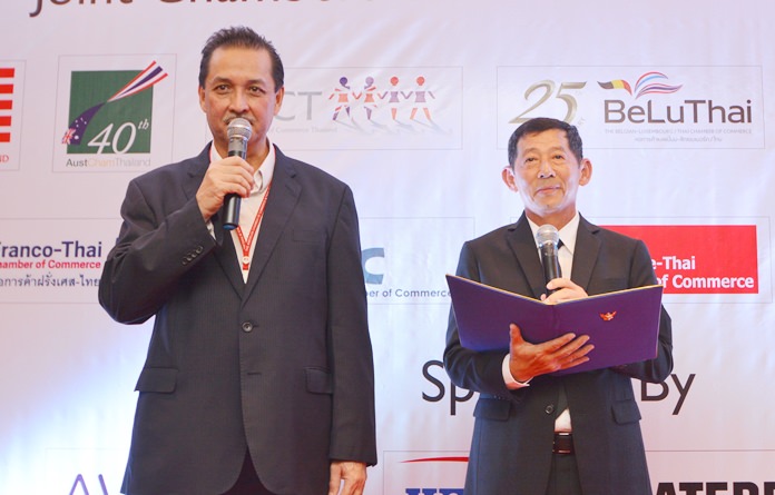 Mayor Anan Charoenchasri (right) addresses the guests. His speech is translated into English by a member of the American Chamber of Commerce Thailand.