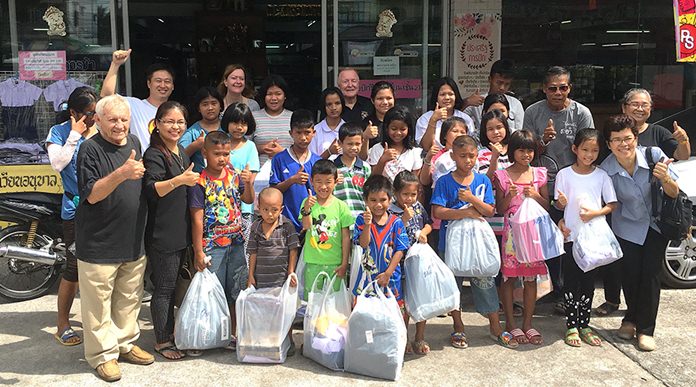 Pictured with the children and parents are left to right: Bernie Tuppin (Jesters) in front; Helle Rantsen (PILC) in back; Erle Kershaw (Jesters) in back; and Khun Mat (BCHOR) in front.
