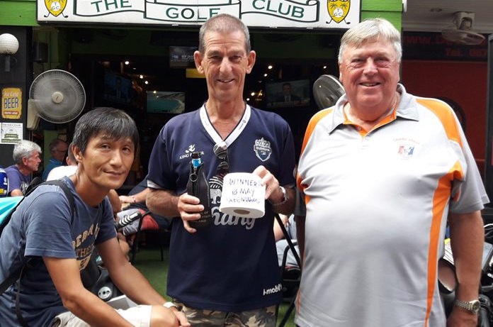 Steve Coughlan (centre) lifts his ‘trophy’ accompanied by Kenny Aihara (left) & Peter Thomas.