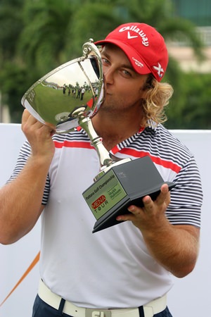 Sweden’s Fredrik From kisses the trophy after winning the Pattana Golf Championship at the Pattana Golf Club in Chonburi, Friday, May 19. 