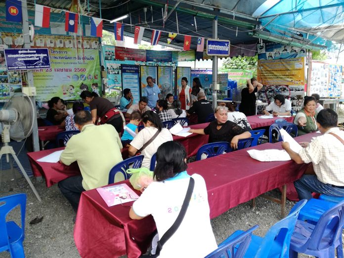 Members of the Soi Korphai Community fill out loan applications to receive part of the 1.6 million baht in loans the community is offering to neighborhood residents to improve their job prospects.