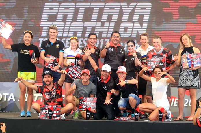 Race winners and medalists pose on stage with city and sports tourism officials at the conclusion of the 2017 Pattaya Triathlon, Sunday, May 28.