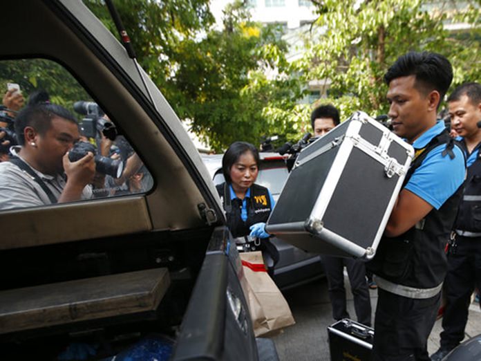 Thai forensic collect evidence. (AP Photo/Sakchai Lalit)